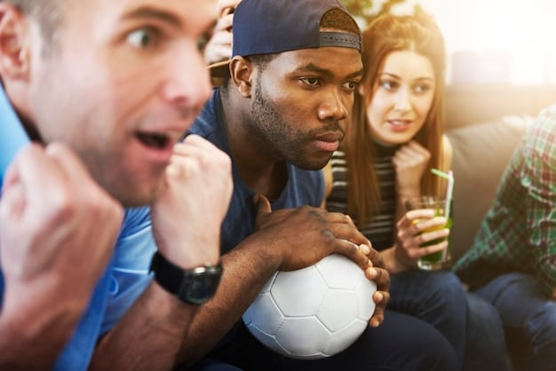 A diverse group of US soccer fans in a stadium, some looking at a jumbotron showing a VAR review, others reacting excitedly, highlighting their engagement with technology in sports.