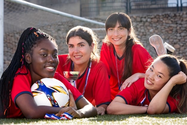 A diverse group of young girls enthusiastically playing soccer on a well-maintained pitch, illustrating the strong grassroots participation in women's soccer in the US.