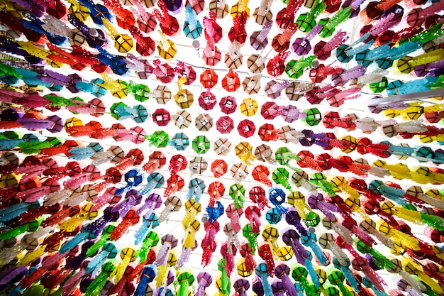 A vibrant mosaic of different human faces representing diverse genders, ethnicities, and abilities, forming the shape of a soccer ball, symbolizing global unity and inclusion in soccer.