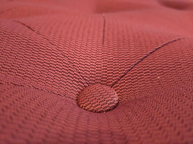 A detailed macro shot of complex stitching around a US Soccer emblem on an authentic jersey, showing perfect thread density and precision.