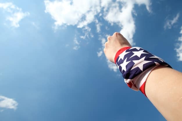 A close-up of a US soccer fan's hands holding a team scarf, with other fans blurring in the background, conveying a sense of community and support at a match.