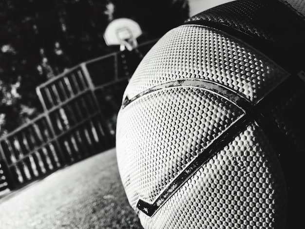 A close-up of a microphone with a soccer ball blurred in the background, symbolizing the intersection of audio content and the sport. The image is crisp and focused.