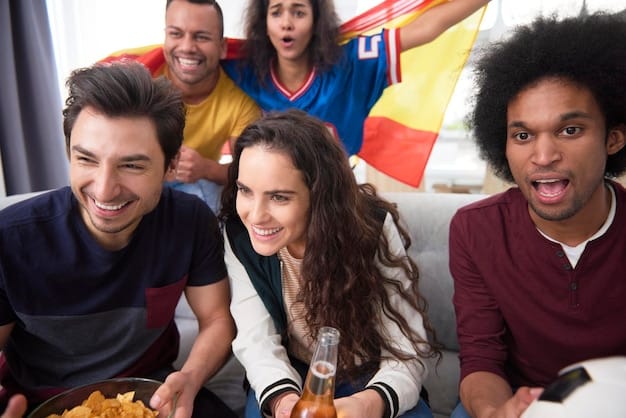 A diverse group of football fans from different countries interacting happily in a fan zone, holding flags and smiling, with a large screen showing a live match in the background.
