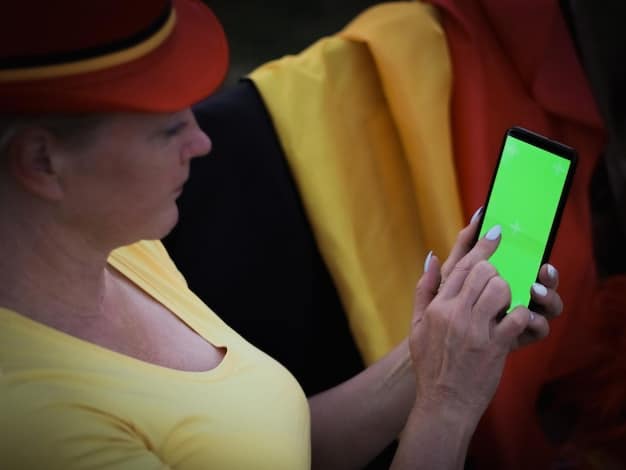A fan holding a smartphone displaying a blockchain-based ticket with a QR code, surrounded by vibrant soccer stadium lights.