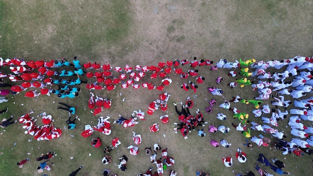 An aerial view of a diverse group of soccer players standing together in solidarity before a match, symbolizing unity and fair play. The image is bright and hopeful, with a focus on the players' commitment to sportsmanship, integrity, and ethical behavior.