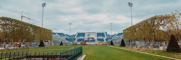 A panoramic view of a modern soccer stadium during an NWSL game, filled with enthusiastic fans. The focus is on the players in action, showcasing the intensity and skill of professional women's soccer in the US. The scoreboard is visible in the background, displaying the game's progress.