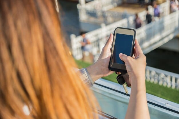 Close-up of a fan scanning a loyalty card at a stadium entrance, showcasing the point-earning process. The fan is smiling and wearing team apparel, highlighting the positive experience of participating in the loyalty program. The image is related to Fan Loyalty Pays Off: How to Maximize Your Rewards Points with the Top 5 US Soccer Clubs in 2025.