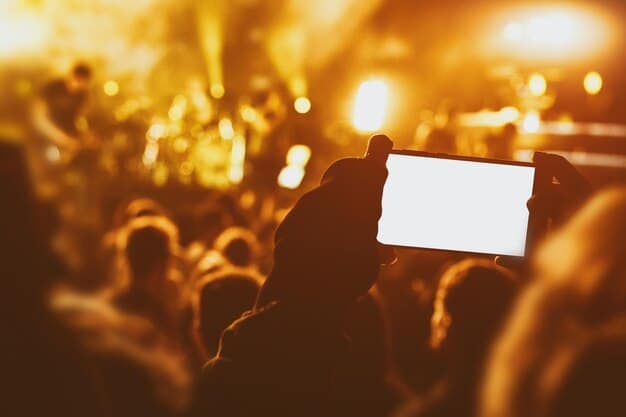 An image showing a fan proudly displaying a VIP pass at a concert. The background is blurred, highlighting the fan and the VIP pass.