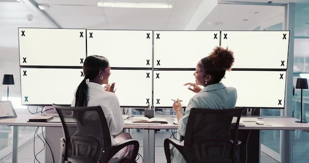 A close-up shot of a VAR official reviewing a play on multiple screens in a darkened room. The screens display various camera angles and data visualizations related to the play. The focus is on the official's intense concentration and the complexity of the technology used in VAR, clearly showing 