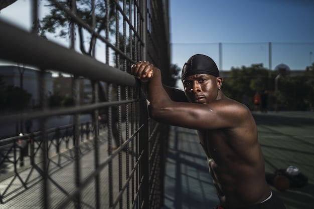 A focused shot of a USMNT player going through a high-intensity fitness drill during a training session. The player is determined and focused, illustrating the intense physical demands of World Cup preparation.