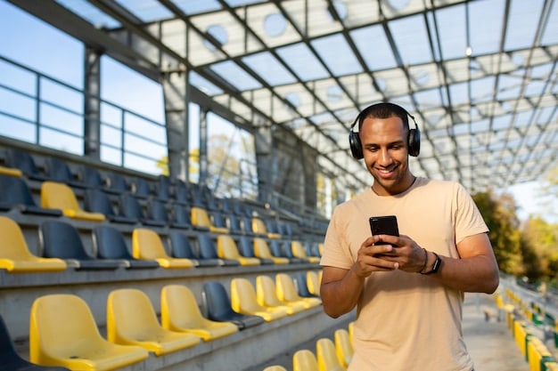 A close-up shot of a fan using a stadium's mobile app on their smartphone during a soccer game, showing features such as live stats, replays, and food ordering options, exemplifying innovations in What are the Latest Innovations in US Soccer Stadium Technology for Fan Engagement.