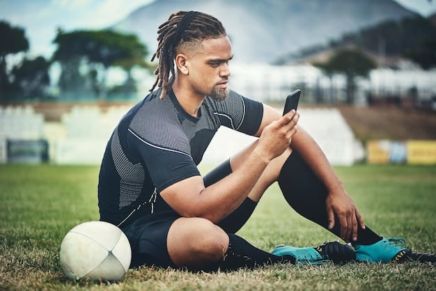 A soccer player wearing a GPS tracker during a training session. The player is running on a green field, and the background shows other players and coaches. The image highlights how wearable technology is used to enhance player performance data and support sustainability efforts.